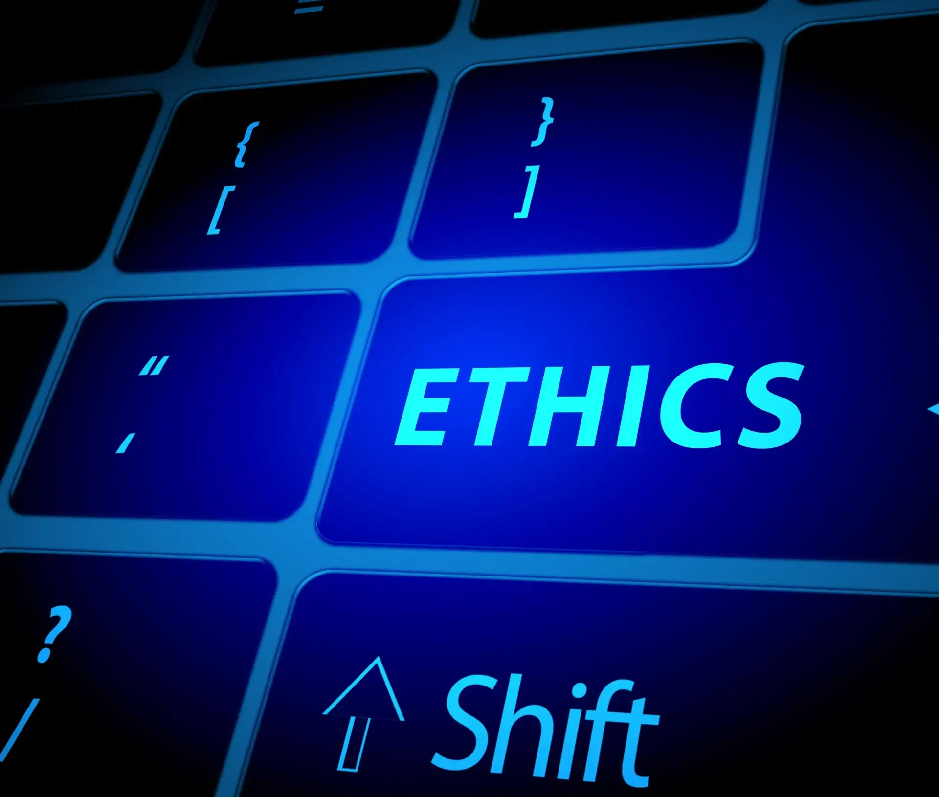 A computer keyboard with a blue key labeled "ethics" sits next to standard keys—including shift—symbolizing ai ethics as a practical guide for smes navigating responsible technology use.