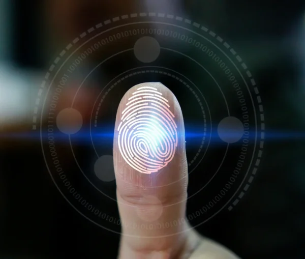A close up of a finger pressing on a digital fingerprint scanner, enhanced with a virtual fingerprint and data graphics, illustrating smarter security through adaptive authentication.