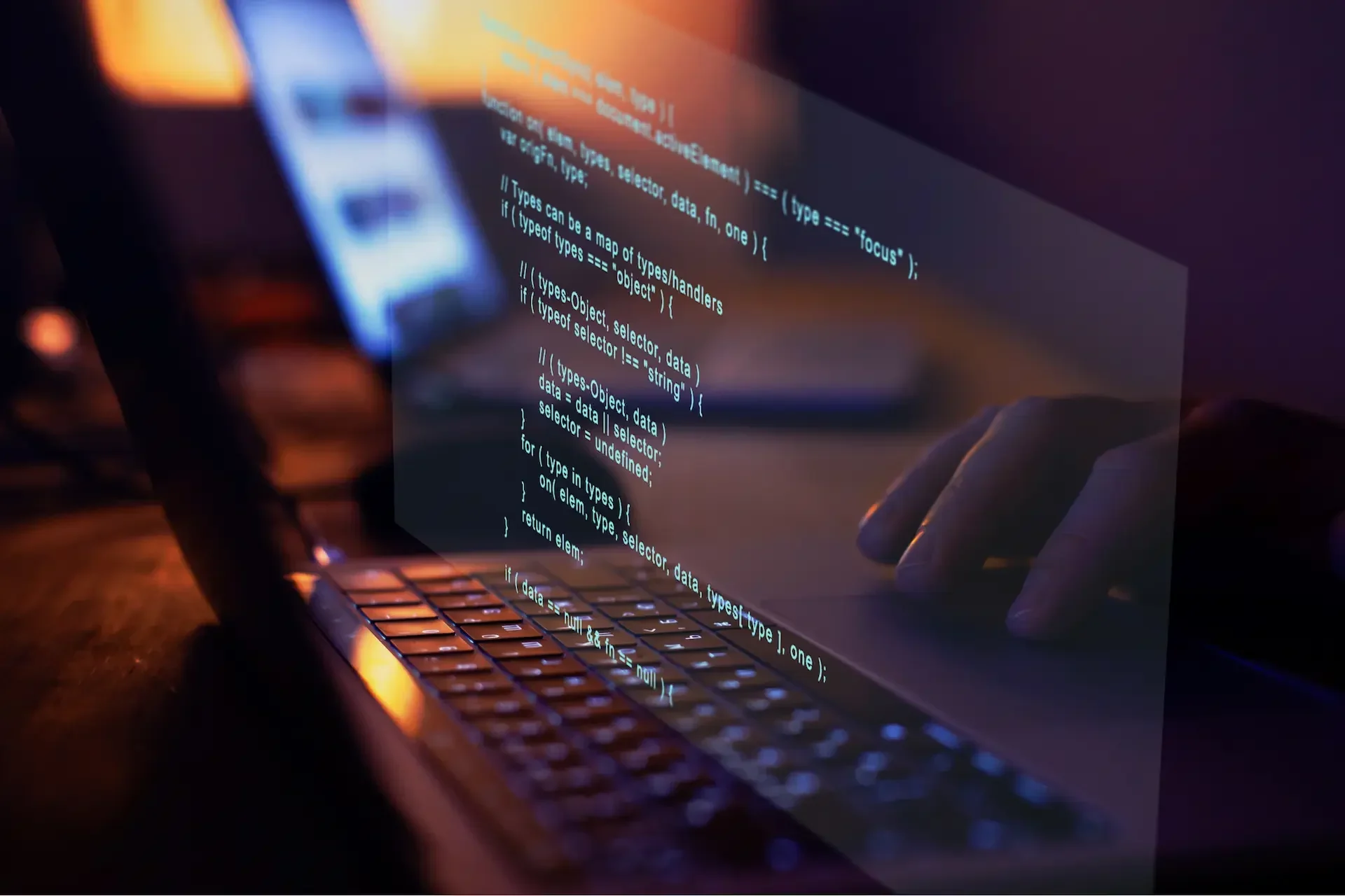 A person types on a laptop keyboard with code displayed on the screen, reflecting a programming environment focused on developing custom software.