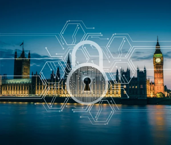 A digital padlock graphic overlays the illuminated uk houses of parliament and big ben at dusk, symbolizing business cybersecurity and highlighting the importance of protecting uk cyber infrastructure.