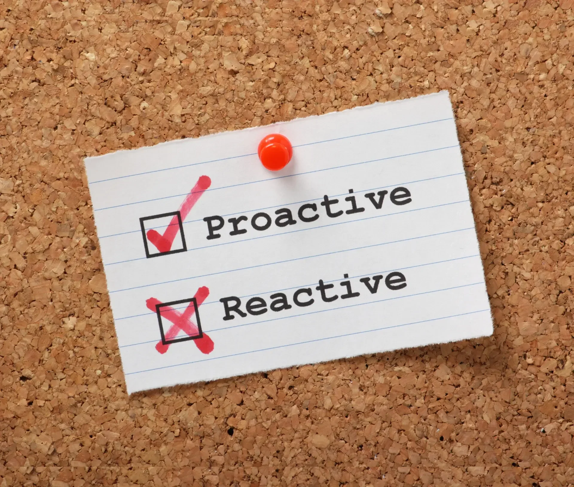A corkboard with a note showing two options: "proactive it" with a checked box, and "reactive it" with an unchecked box crossed out, highlighting the shift in it strategy.