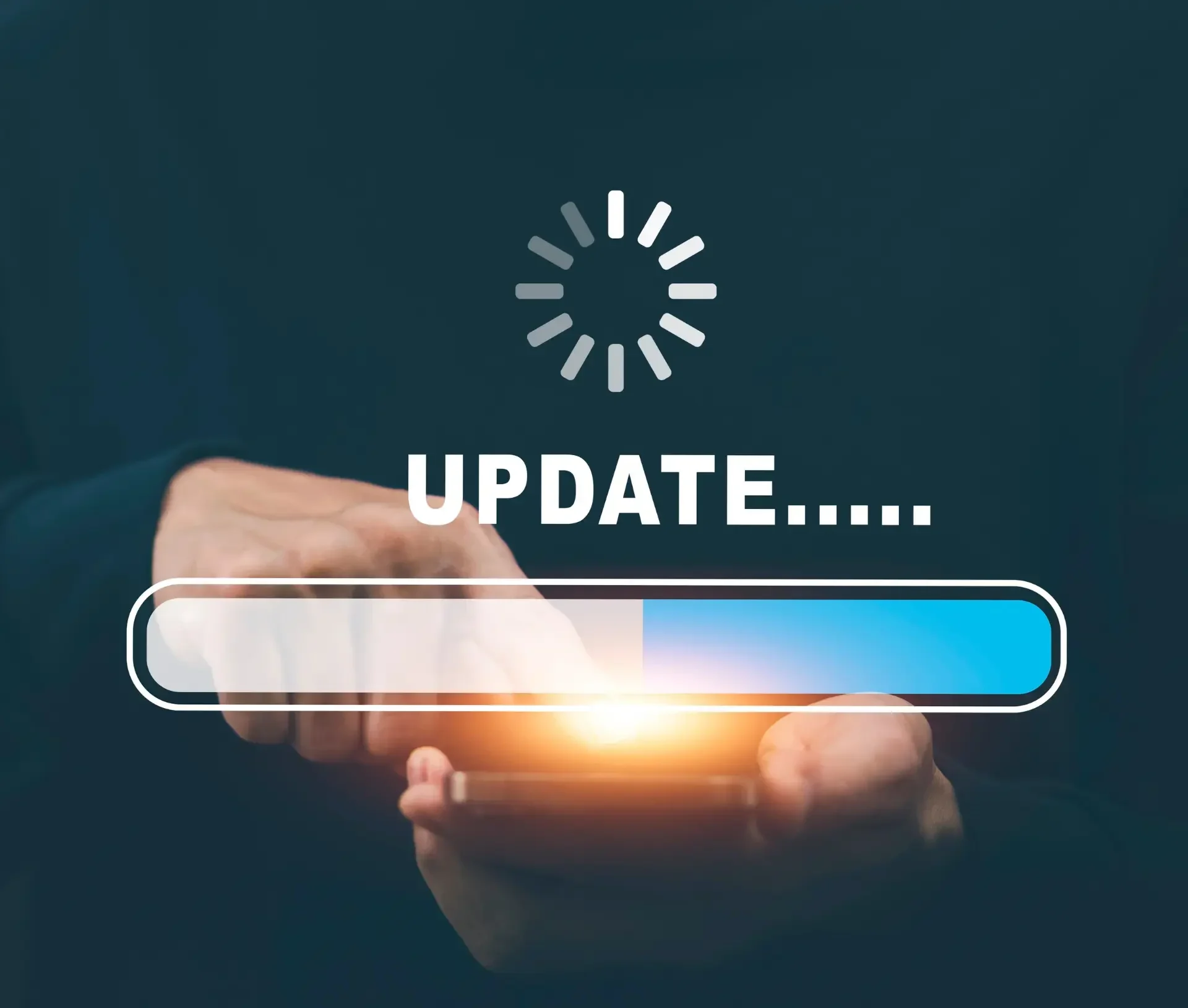 A person uses a smartphone with a progress bar and the word "update" displayed, highlighting the importance of patch management for maintaining endpoint security during software updates.