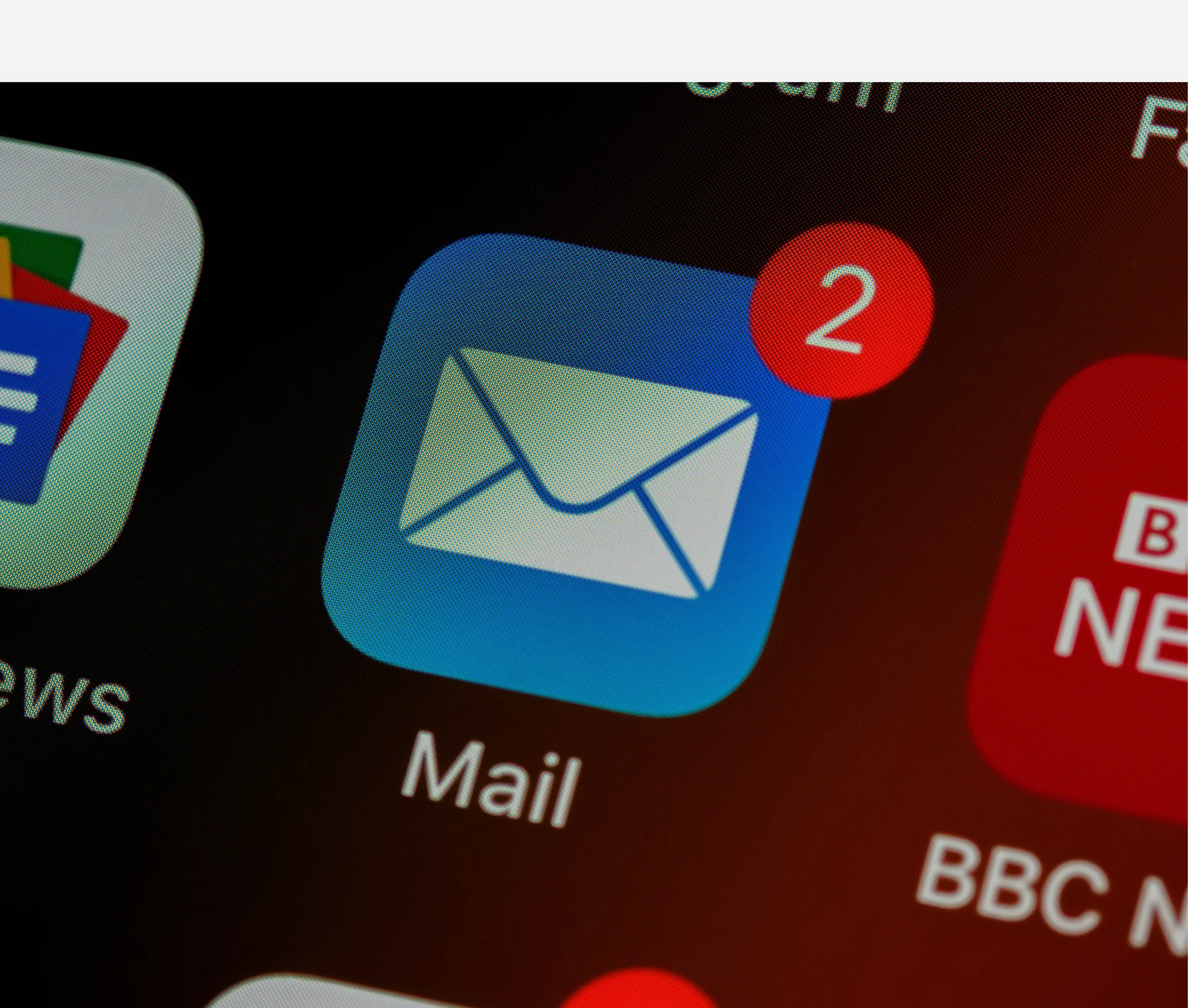 Mail app icon on a smartphone home screen with a red notification badge showing the number 2, representing a potential phishing awareness alert.