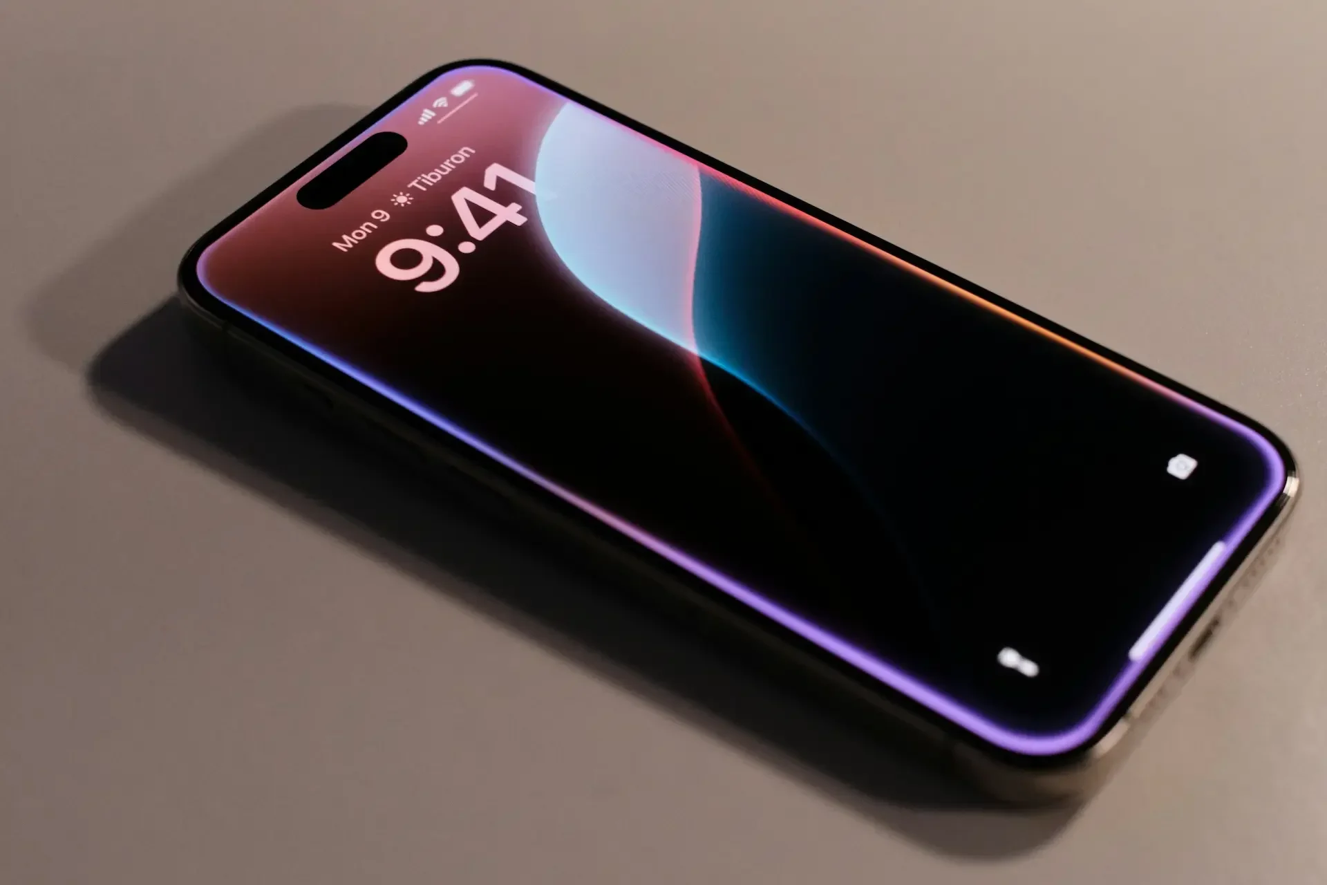 A modern smartphone lies on a flat surface, displaying the lock screen with the time 9:41 and the date monday, 9 january—hinting at apple’s ai shaping the next wave of innovation.