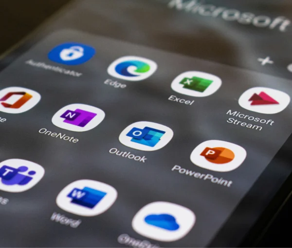A smartphone screen displaying a grid of Microsoft 365 app icons, including Edge, Excel, OneNote, Outlook, PowerPoint, and Word.