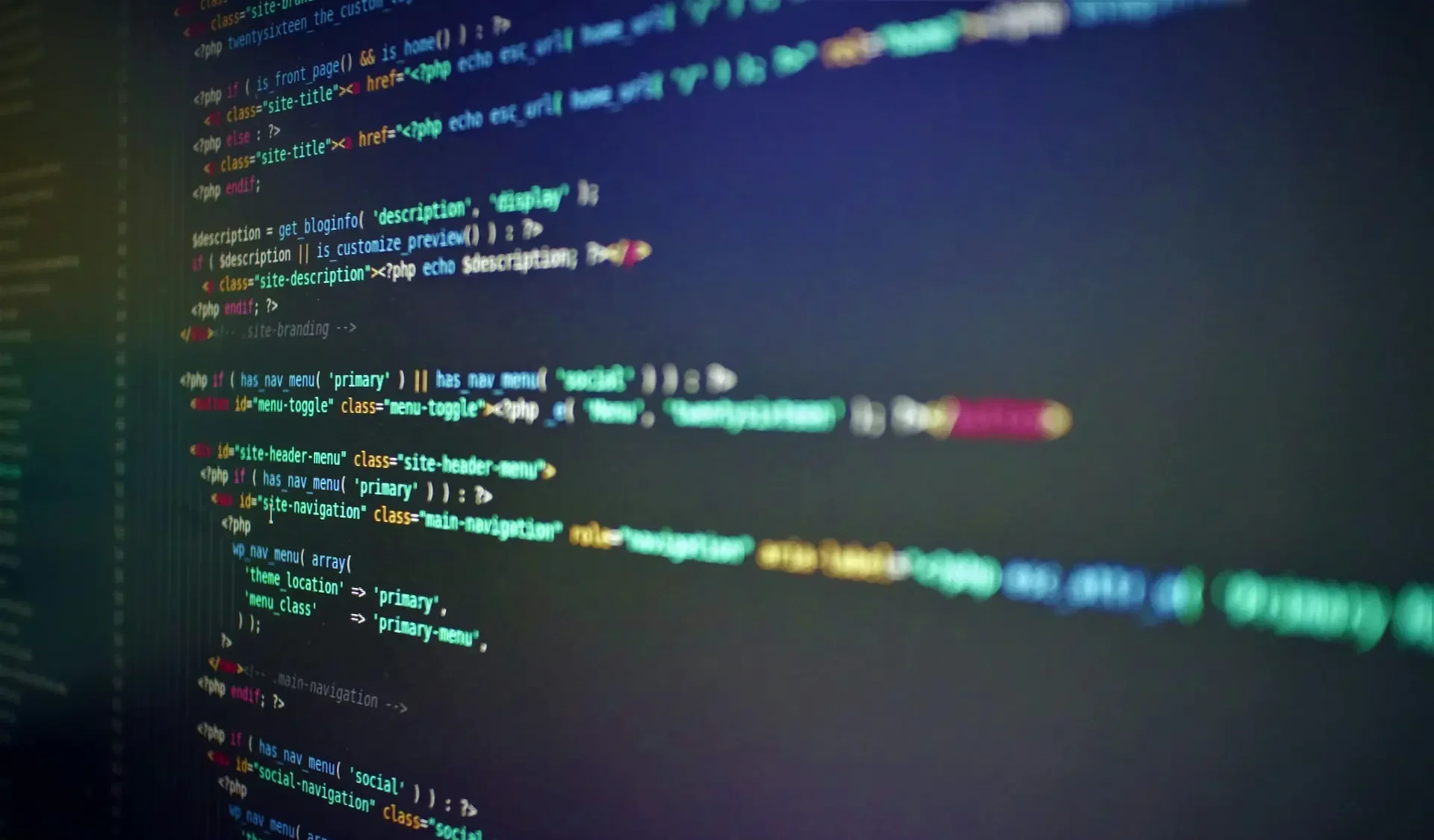 Computer screen displaying colorful lines of code, including html, php, and low code elements, on a dark background.