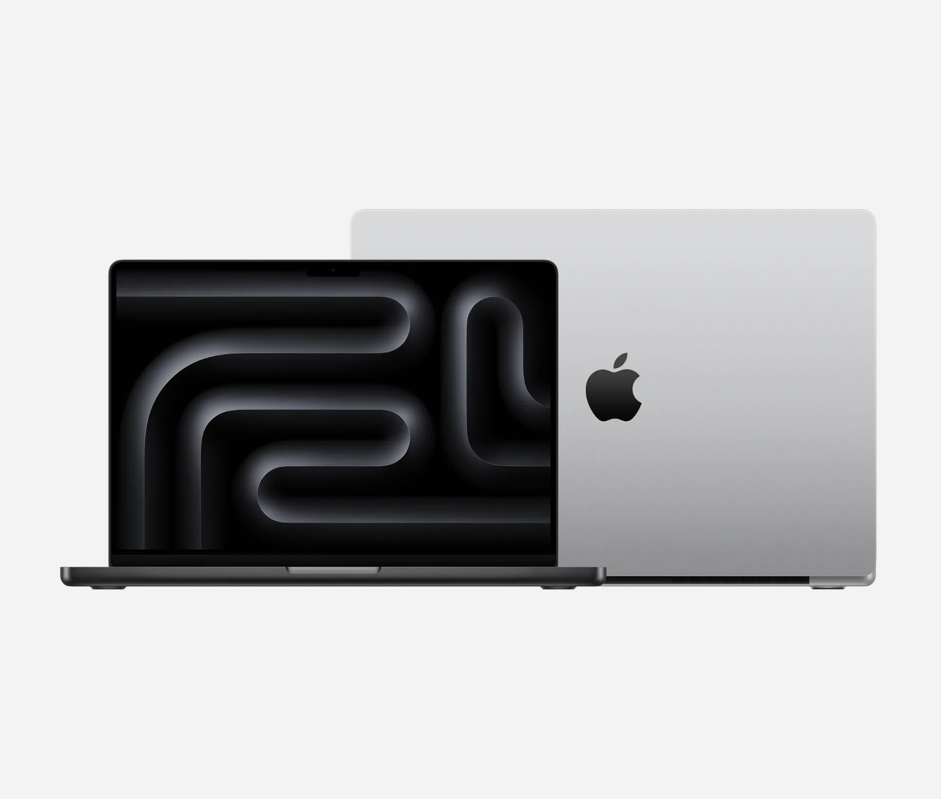 Two silver Apple MacBook Pro laptops shown from the front and back, representing hardware managed within a Mac fleet.