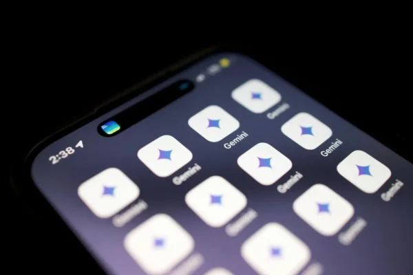 Close up of a smartphone screen displaying multiple "gemini ai" app icons, each with a blue and purple star logo, against a dark background. the time shown is 2:38, hinting at advanced features like summaries and pdfs.